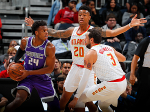 ATLANTA, GA - NOVEMBER 15: John Collins #20 and Marco Belinelli #3 of the Atlanta Hawks defend against Buddy Hield #24 of the Sacramento Kings at Philips Arena on November 15, 2017 in Atlanta, Georgia. NOTE TO USER: User expressly acknowledges and agrees that, by downloading and or using this photograph, User is consenting to the terms and conditions of the Getty Images License Agreement. 
