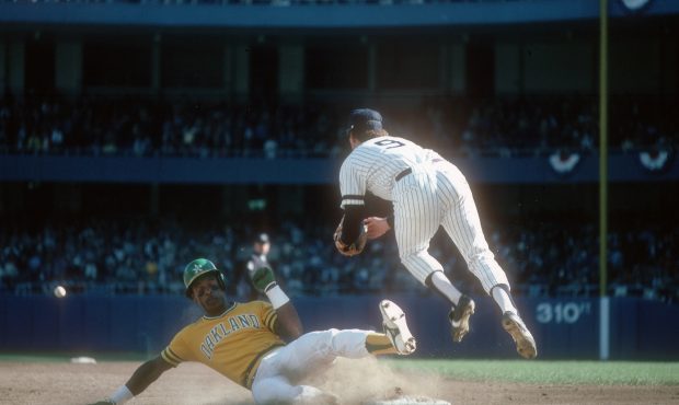 NEW YORK - CIRCA 1981: Graig Nettles #9 of the New York Yankees takes the throw at third, leaping o...
