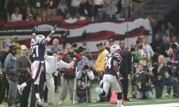 NEW ORLEANS, LA - FEBRUARY 03:  Ty Law #24 of the New England Patriots returns an interception fort...