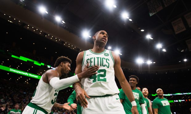 BOSTON, MA - FEBRUARY 27: Al Horford #42 of the Boston Celtics is congratulated by Marcus Smart #36...