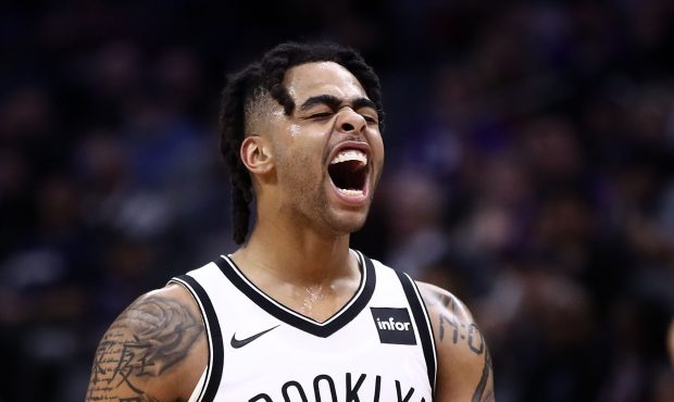 SACRAMENTO, CALIFORNIA - MARCH 19: D'Angelo Russell #1 of the Brooklyn Nets reacts during their gam...