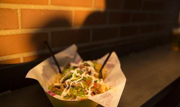 DENVER, CO - Colorado Queso Stak are waffle fries with green chile and carnitas, at the Rockies' Co...