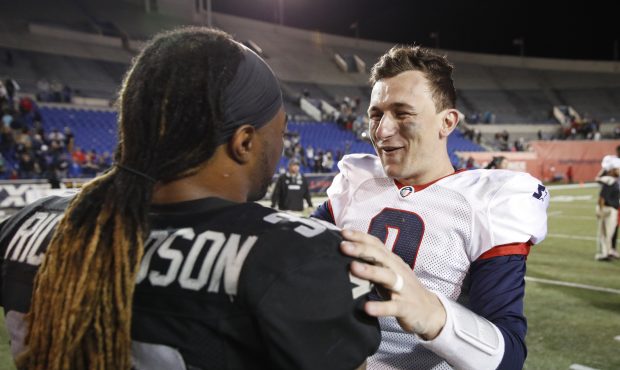 MEMPHIS, TN - MARCH 24: Johnny Manziel #2 of the Memphis Express talks with Trent Richardson #33 of...