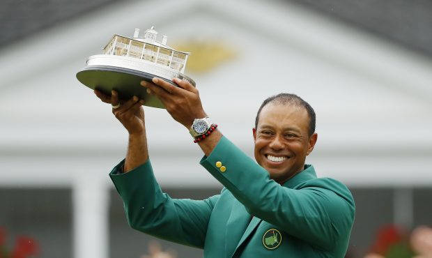 AUGUSTA, GEORGIA - APRIL 14: Tiger Woods of the United States celebrates with the Masters Trophy du...