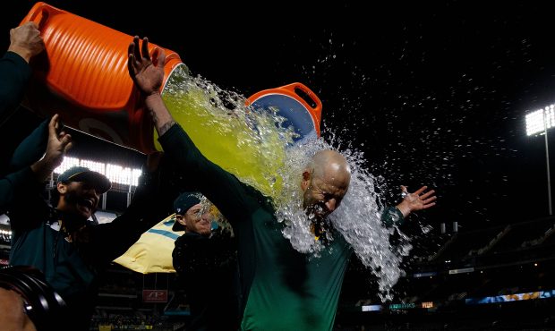 OAKLAND, CA - MAY 07: Mike Fiers #50 of the Oakland Athletics has Gatorade poured on him by teammat...