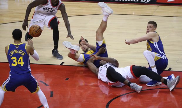 TORONTO, ON- MAY 30 - Golden State Warriors guard Klay Thompson (11) wins the dive to a loose ball ...