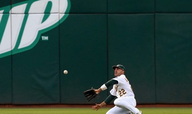 OAKLAND, CA - JULY 03: Ramon Laureano #22 of the Oakland Athletics make a sliding catch taking a hi...