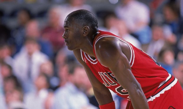 1988: Michael Jordan #23 of the Chicago Bulls rests on the court during a game....