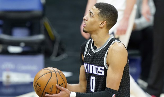 Tyrese Haliburton #0 of the Sacramento Kings stands at the line to shoot a foul shot against the De...
