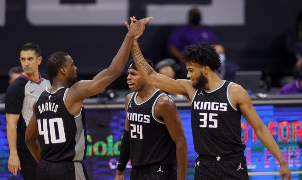 Harrison Barnes #40 of the Sacramento Kings is congratulated by Buddy Hield #24 and Marvin Bagley I...