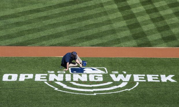 UNITED STATES - MARCH 30: A worker paints the MLB logo of the field during a media tour of National...