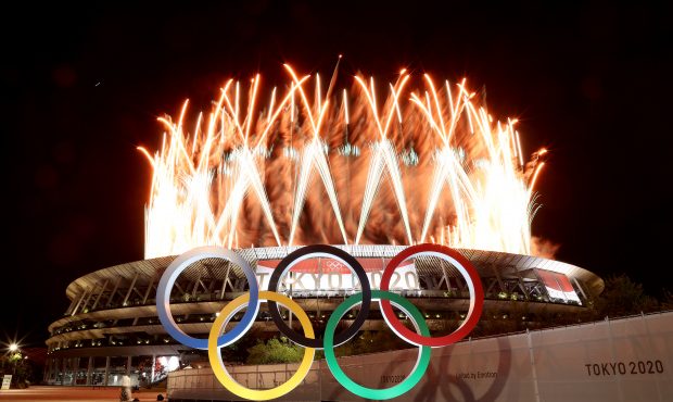 TOKYO, JAPAN - JULY 23: The Olympic Rings are seen outside the stadium as fireworks go off during t...
