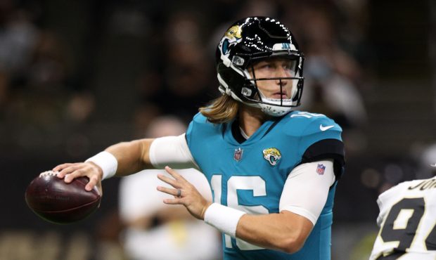 NEW ORLEANS, LOUISIANA - AUGUST 23: Trevor Lawrence #16 of the Jacksonville Jaguars looks to throw ...