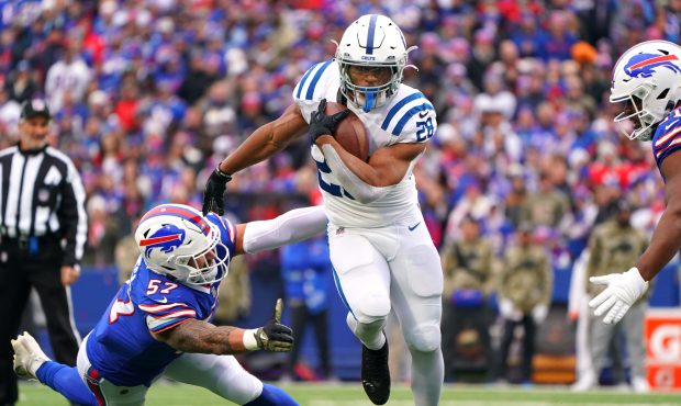 ORCHARD PARK, NEW YORK - NOVEMBER 21: Jonathan Taylor #28 of the Indianapolis Colts avoids a tackle...
