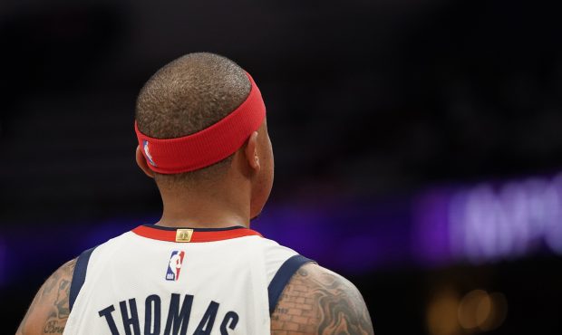 WASHINGTON, DC - DECEMBER 18: Isaiah Thomas #4 of the Washington Wizards looks on in the first half...
