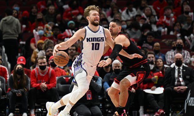 CHICAGO, ILLINOIS - FEBRUARY 16: Domantas Sabonis #10 of the Sacramento Kings attempts to drive to ...