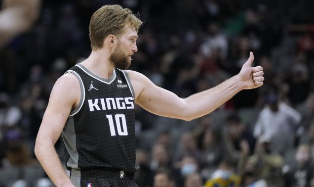 Domantas Sabonis #10 of the Sacramento Kings reacts after a teammate scored a basket against the Mi...