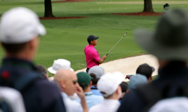AUGUSTA, GEORGIA - APRIL 07: Tiger Woods plays shots from the practice green during the first round...