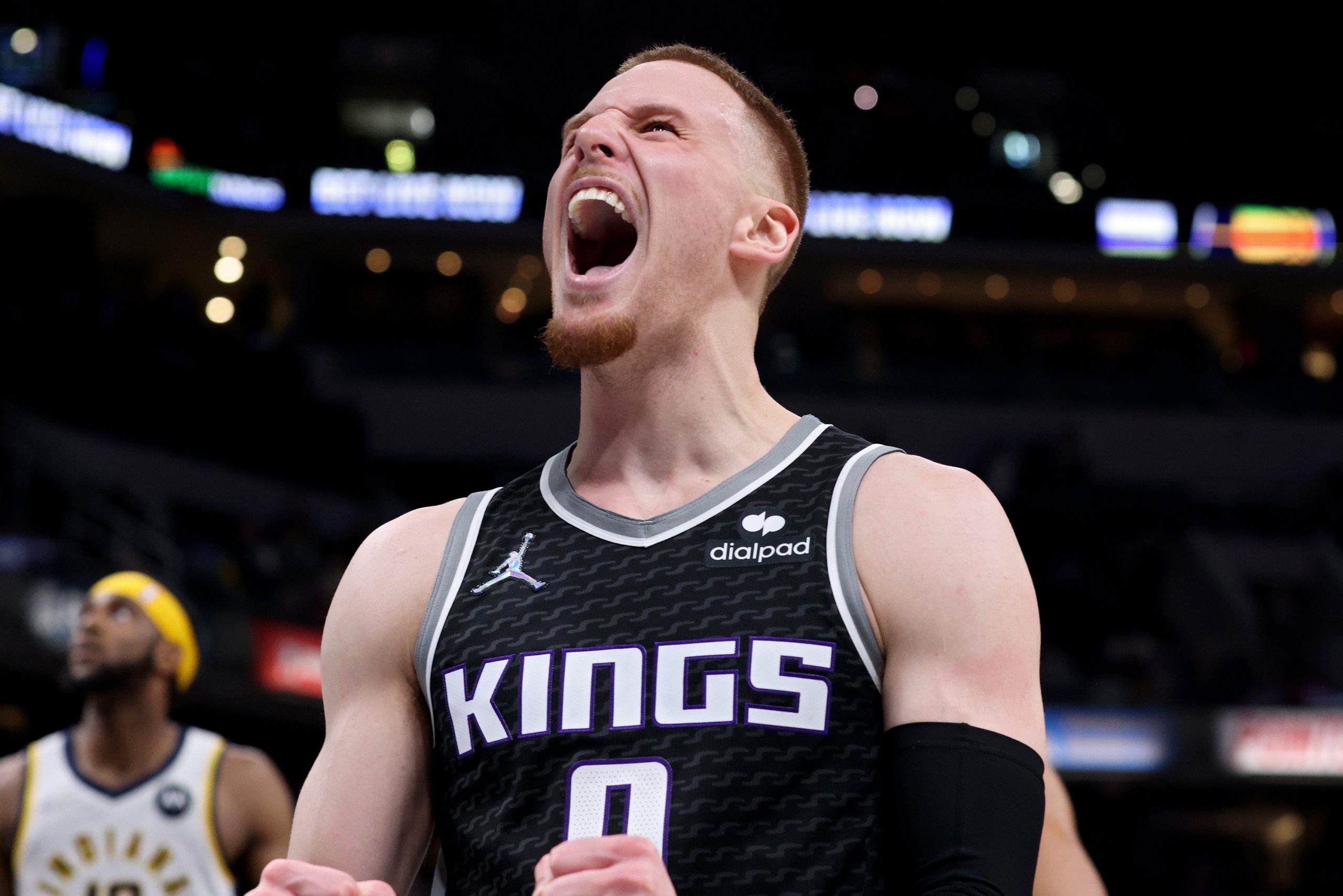 INDIANAPOLIS, INDIANA - MARCH 23: Donte DiVincenzo #0 of the Sacramento Kings celebrates in the fou...