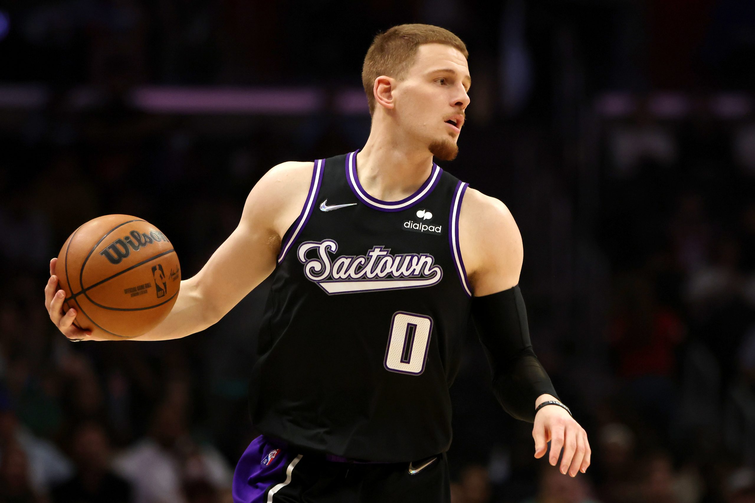 LOS ANGELES, CALIFORNIA - APRIL 09: Donte DiVincenzo #0 of the Sacramento Kings brings the ball up ...