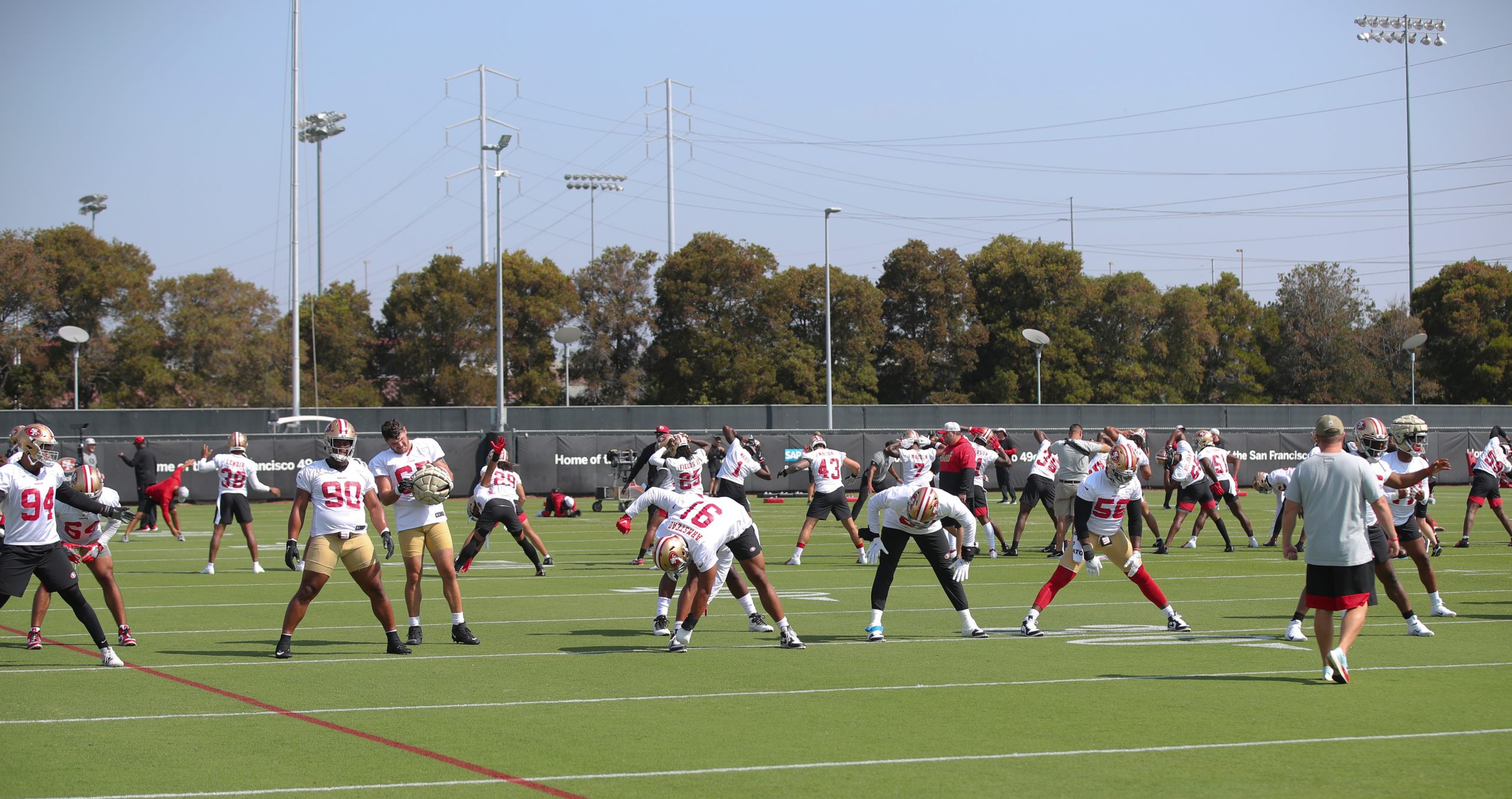 SANTA CLARA, CALIFORNIA - JULY 30: The San Francisco 49ers stretch during training camp at SAP Perf...