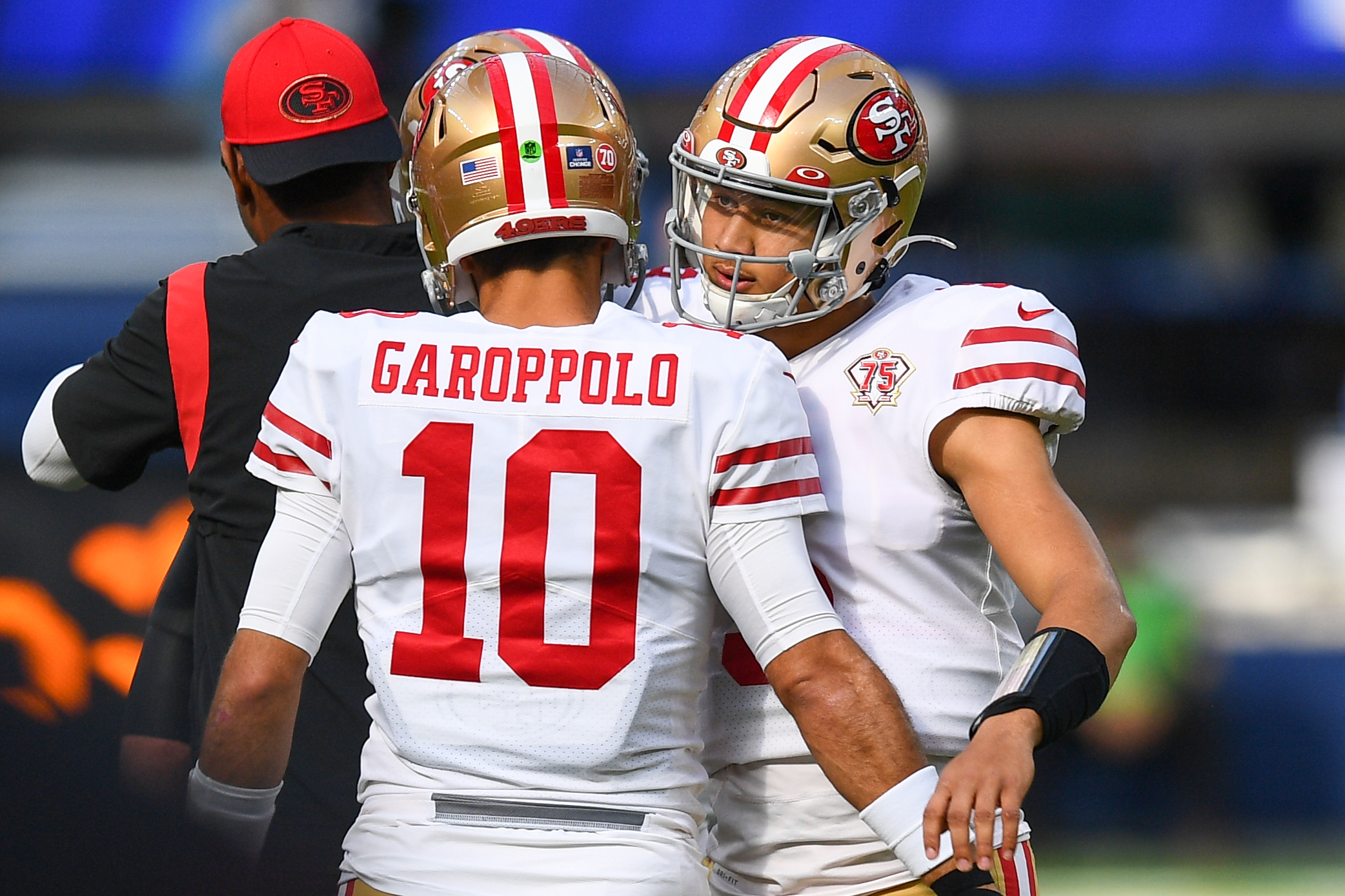 San Francisco 49ers Quarterback Jimmy Garoppolo (10) hugs San Francisco 49ers Quarterback Trey Lanc...