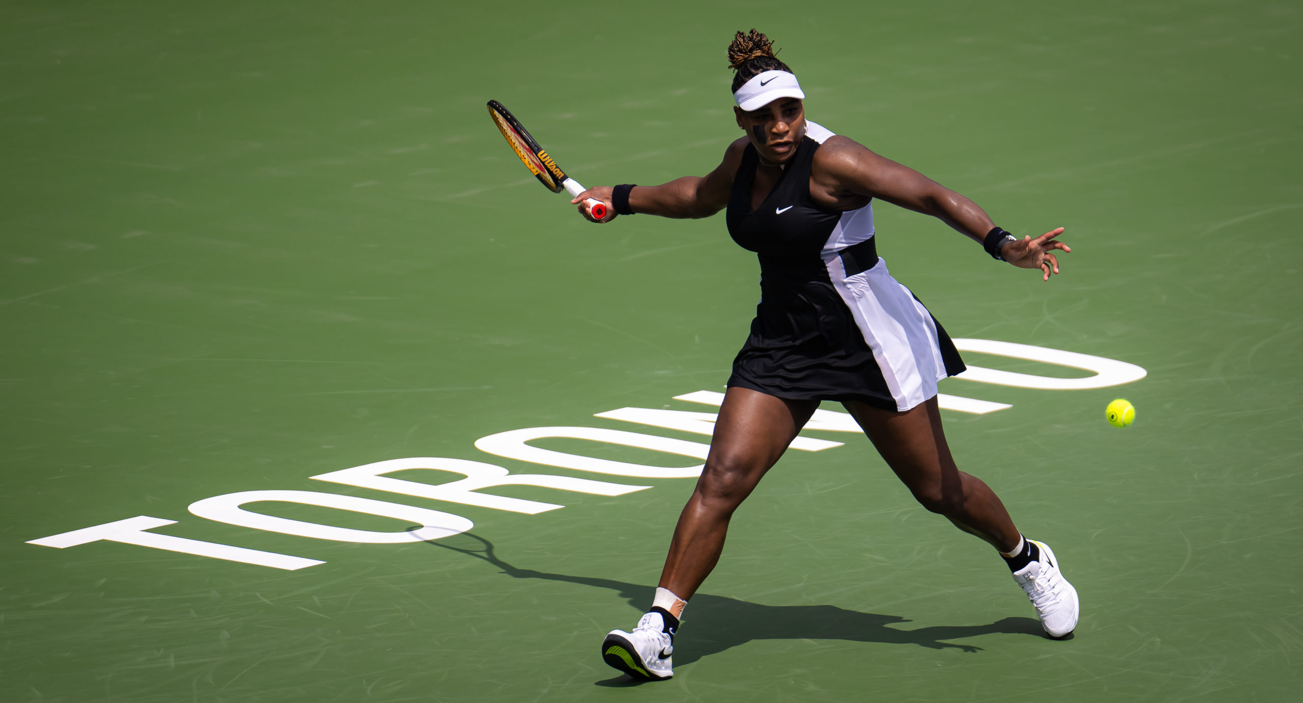 Serena Williams of the United States hits a shot against Nuria Parrizas Diaz of Spain during her fi...