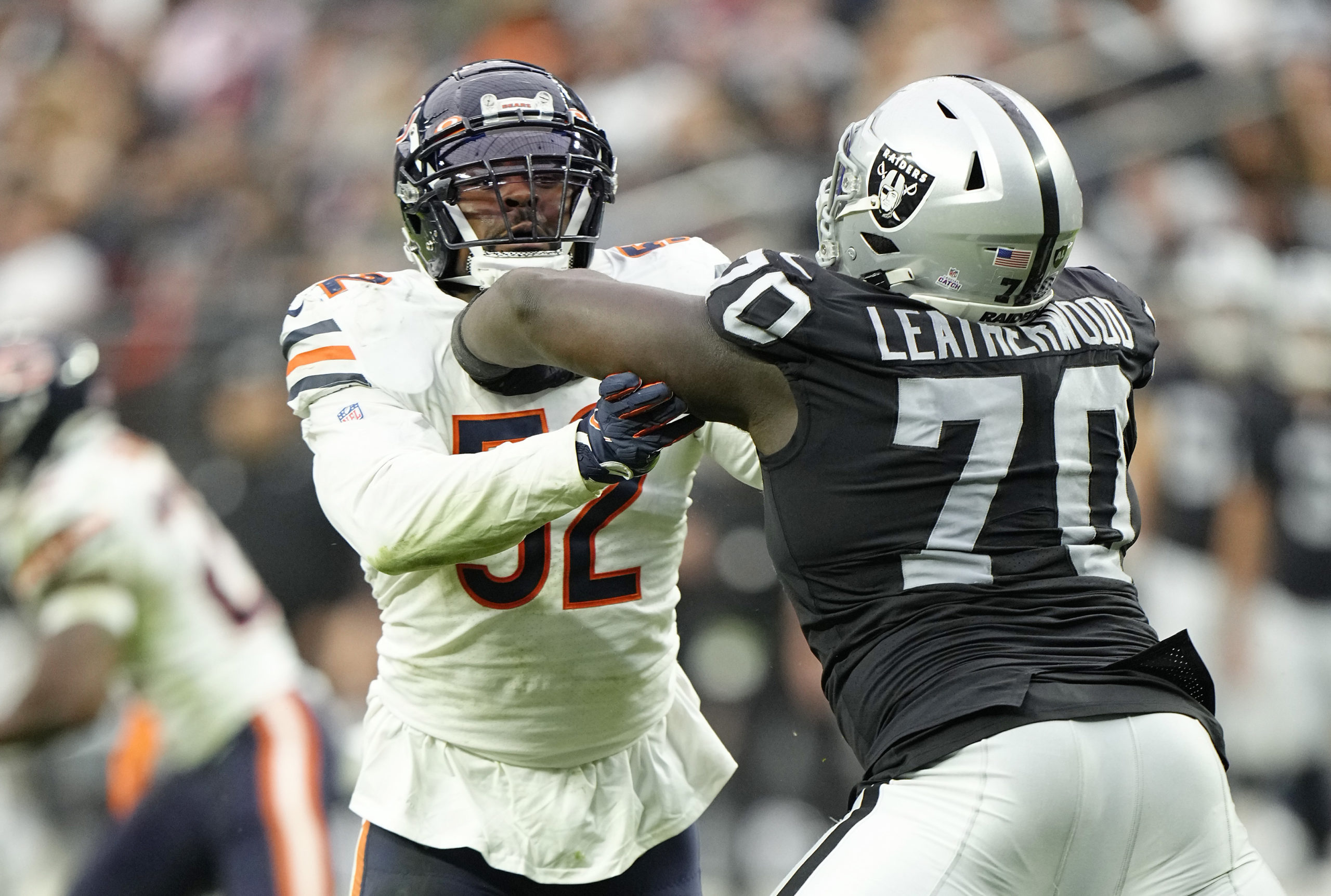Khalil Mack #52 of the Chicago Bears rushes as Alex Leatherwood #70 of the Las Vegas Raiders guards...