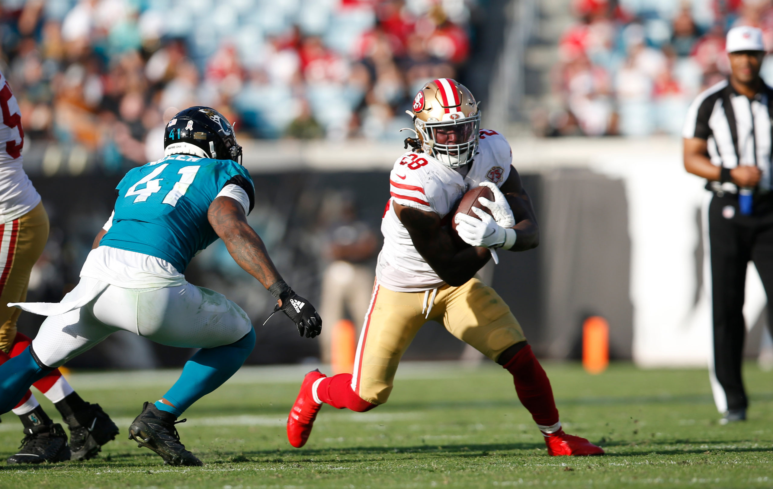 Trey Sermon #28 of the San Francisco 49ers rushes during the game against the Jacksonville Jaguars ...