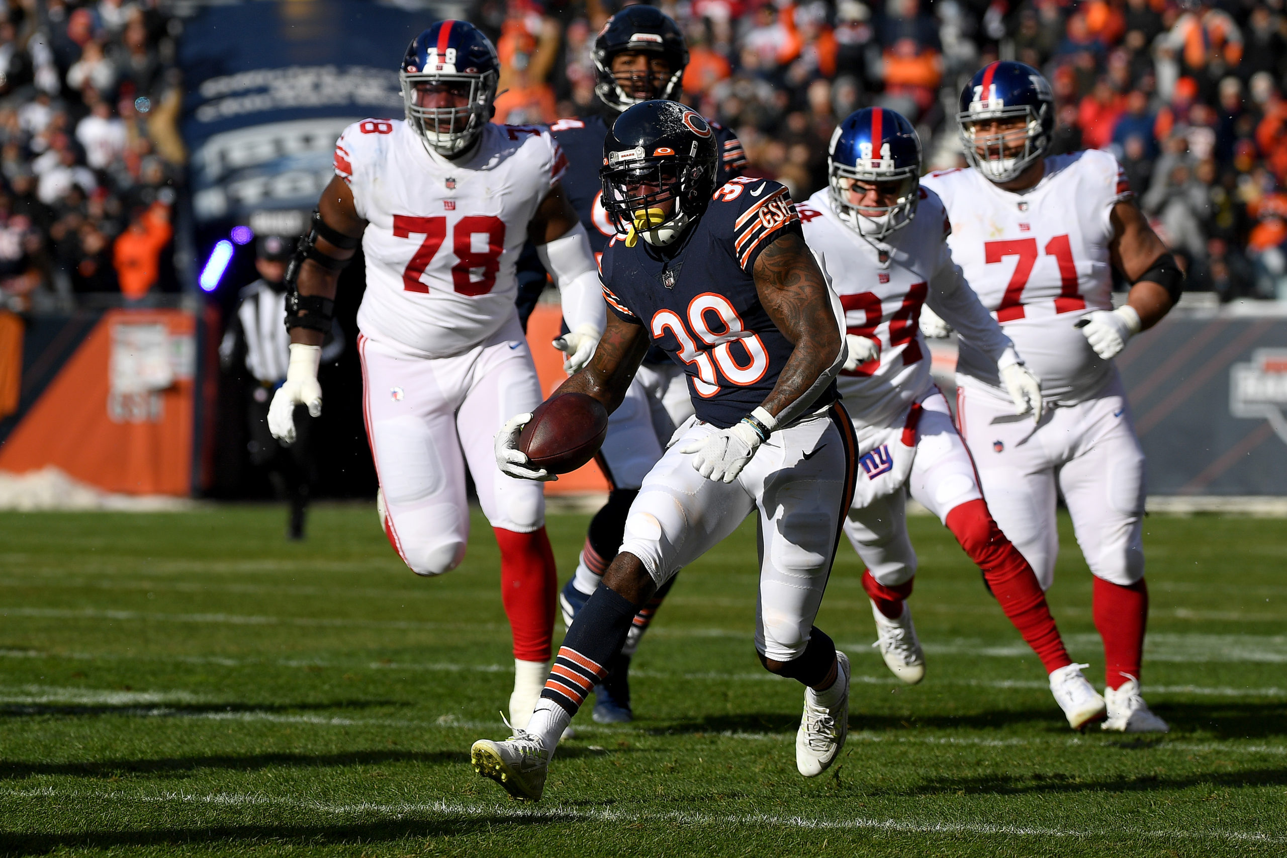 Tashaun Gipson #38 of the Chicago Bears runs with the ball after an interception in the first quart...