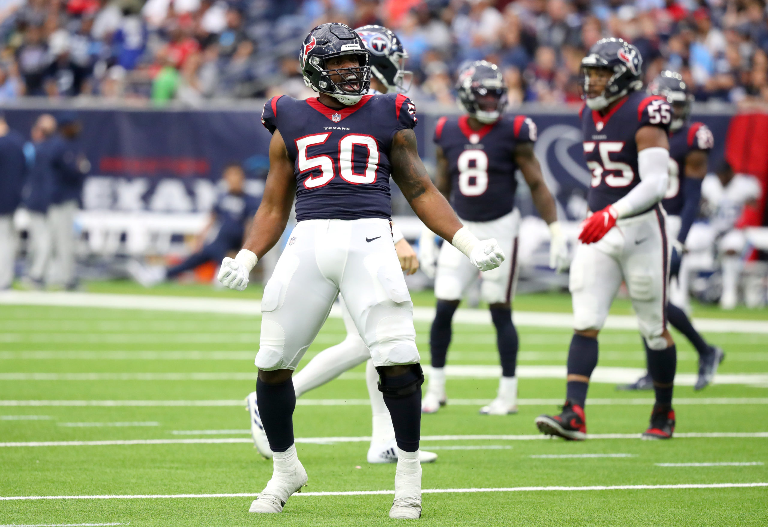 Jordan Jenkins #50 of the Houston Texans reacts after a defensive stop during the third quarter aga...