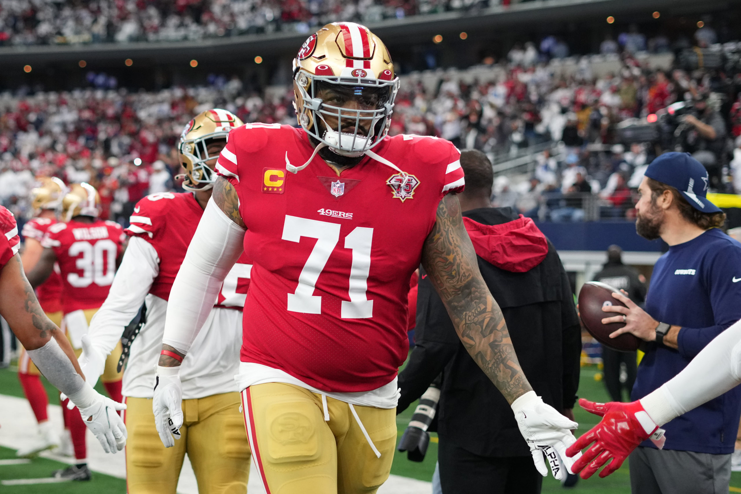 Trent Williams #71 of the San Francisco 49ers runs onto the field against the Dallas Cowboys prior ...