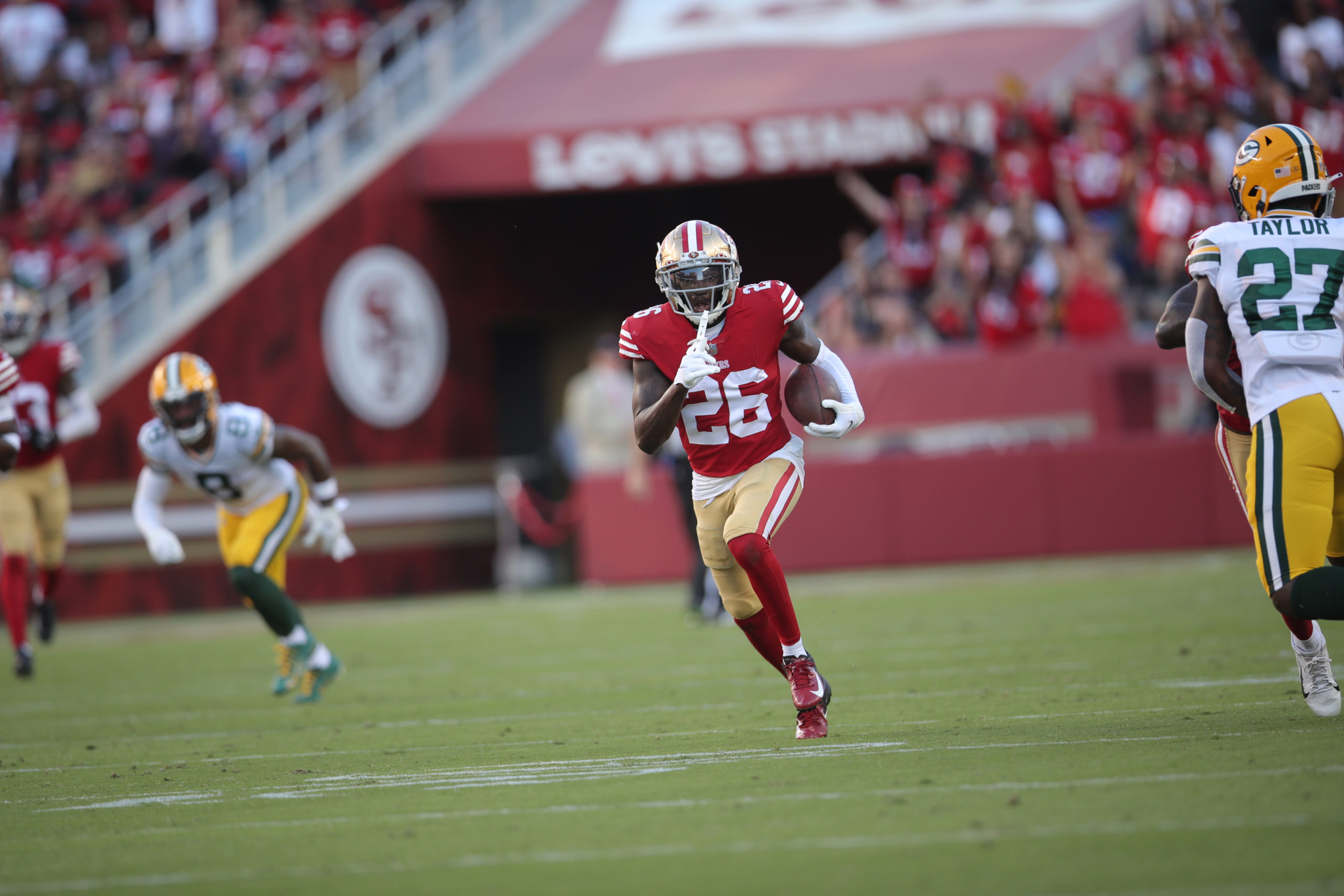 Samuel Womack III #26 of the San Francisco 49ers returns an interception during the game against th...