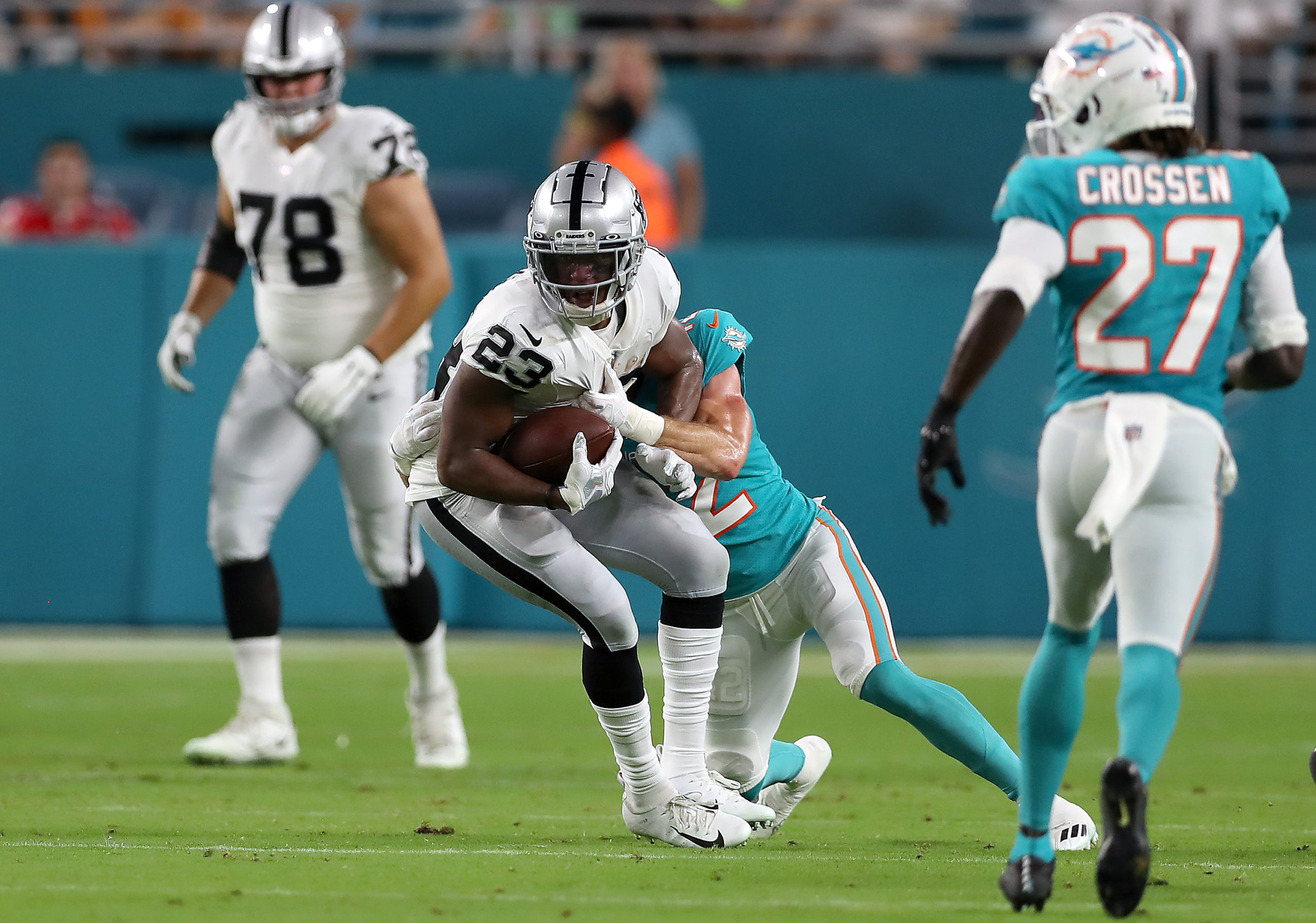 Kenyan Drake #23 of the Las Vegas Raiders carries the ball during the second quarter against the Mi...
