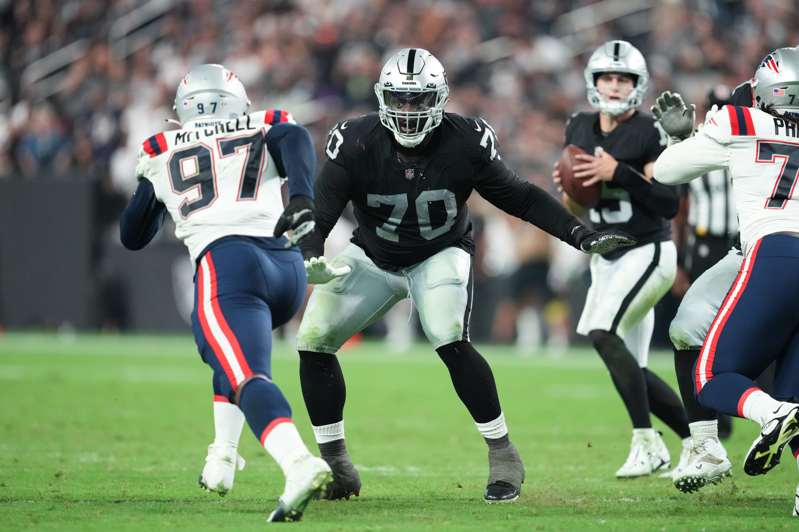 Offensive tackle Alex Leatherwood of the Las Vegas Raiders looks to block during the second half of...