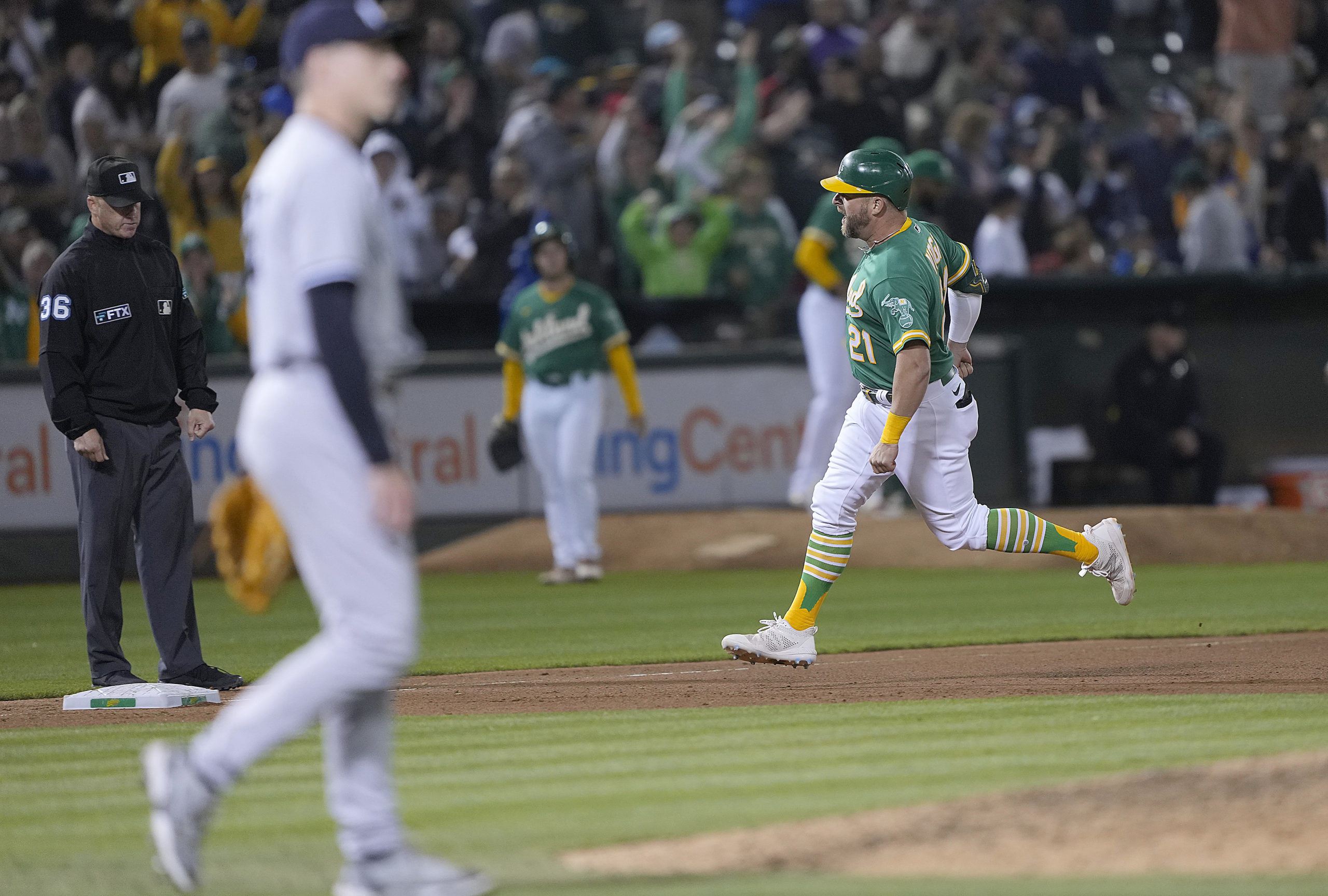 OAKLAND, CALIFORNIA - AUGUST 27: Stephen Vogt #21 of the Oakland Athletics trots around the bases a...