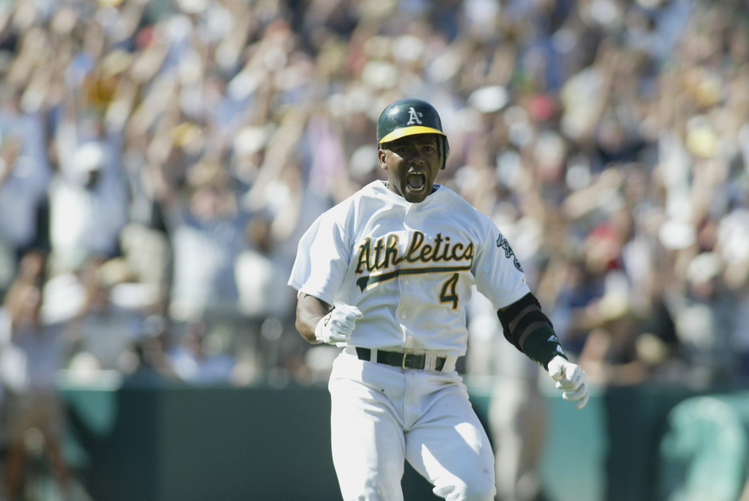 OAKLAND, CA - SEPTEMBER 2: Miguel Tejada #4 of the Oakland A's celebrates hitting a game winning si...