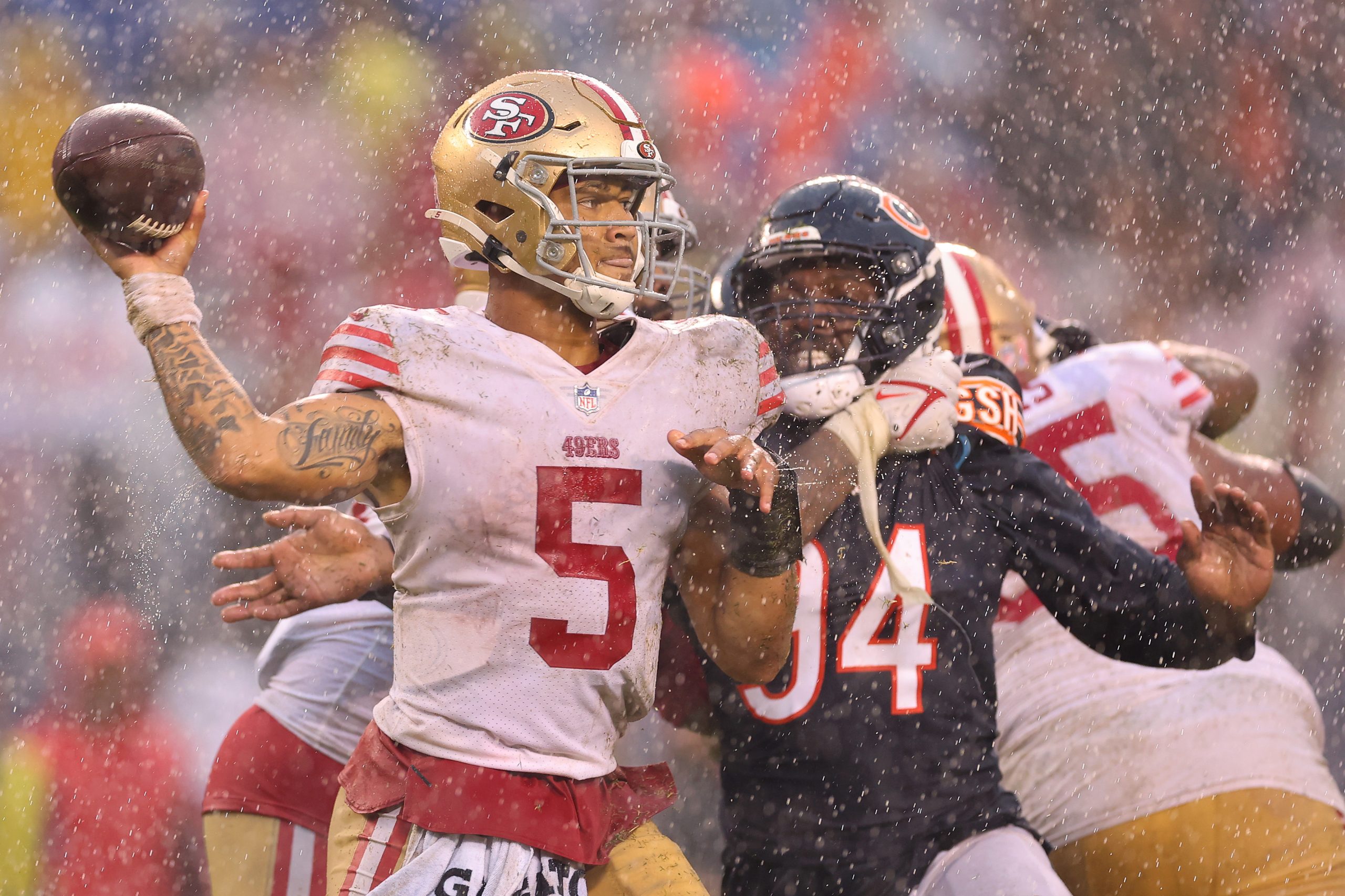 Trey Lance #5 of the San Francisco 49ers throws a pass against the Chicago Bears during the fourth ...