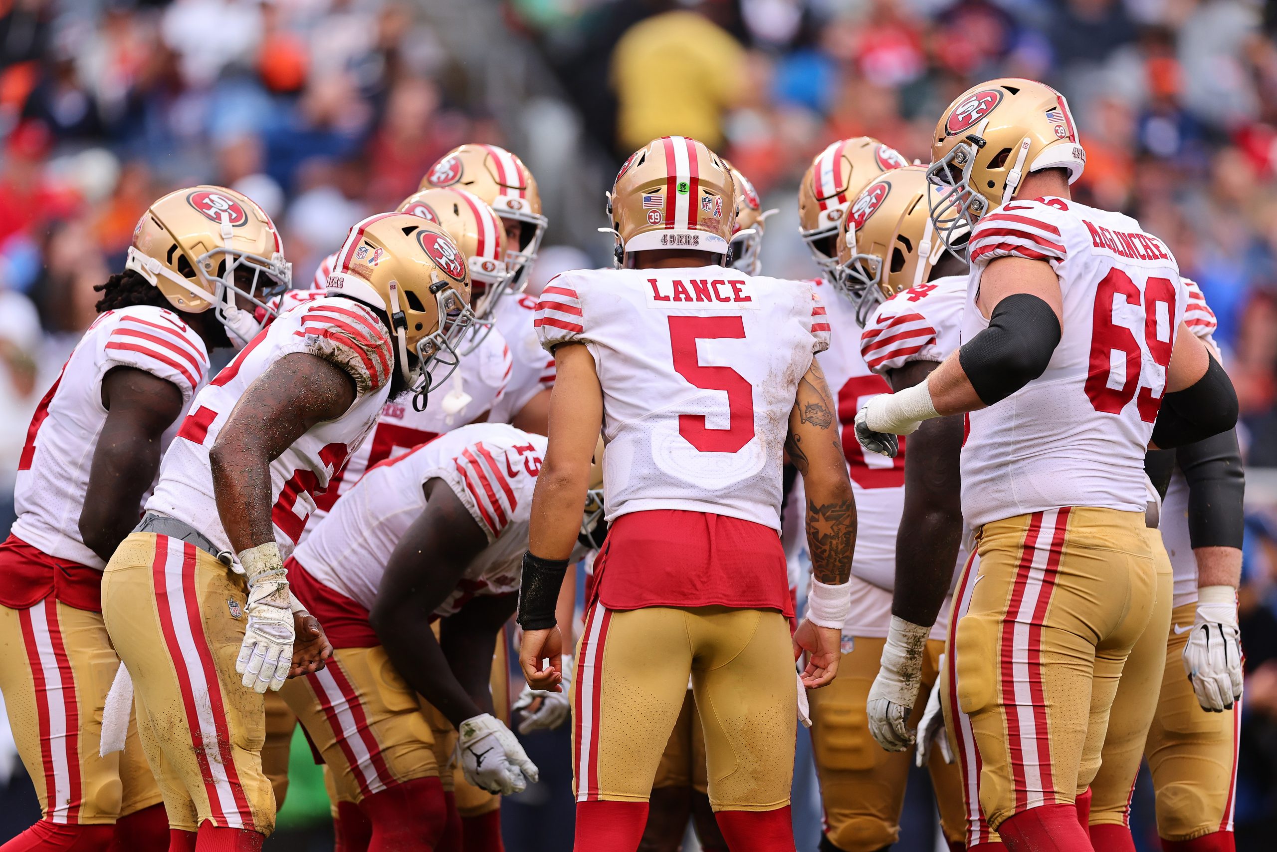 CHICAGO, ILLINOIS - SEPTEMBER 11: Trey Lance #5 of the San Francisco 49ers huddles with the offense...