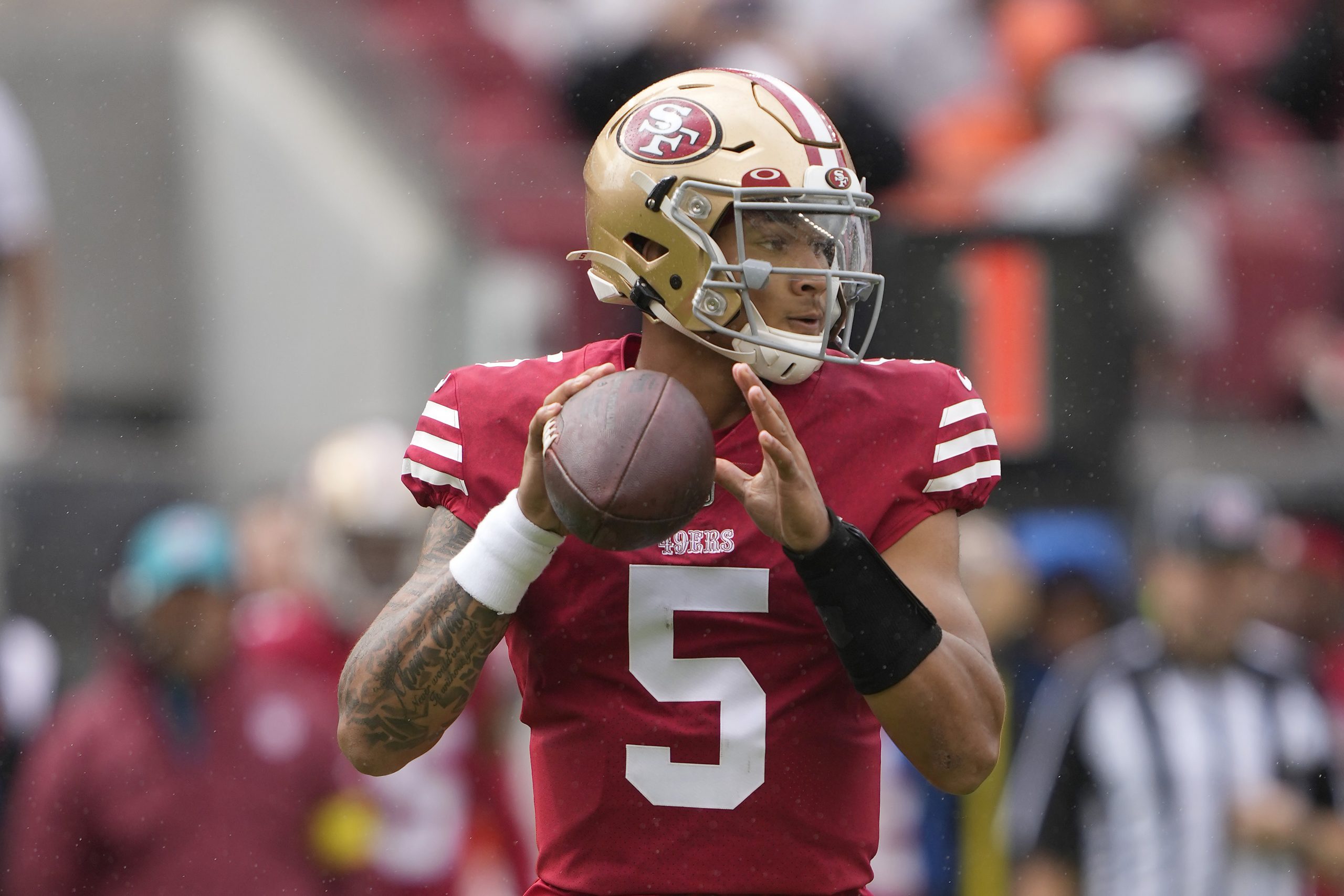 Trey Lance #5 of the San Francisco 49ers looks to pass the ball against the Seattle Seahawks during...