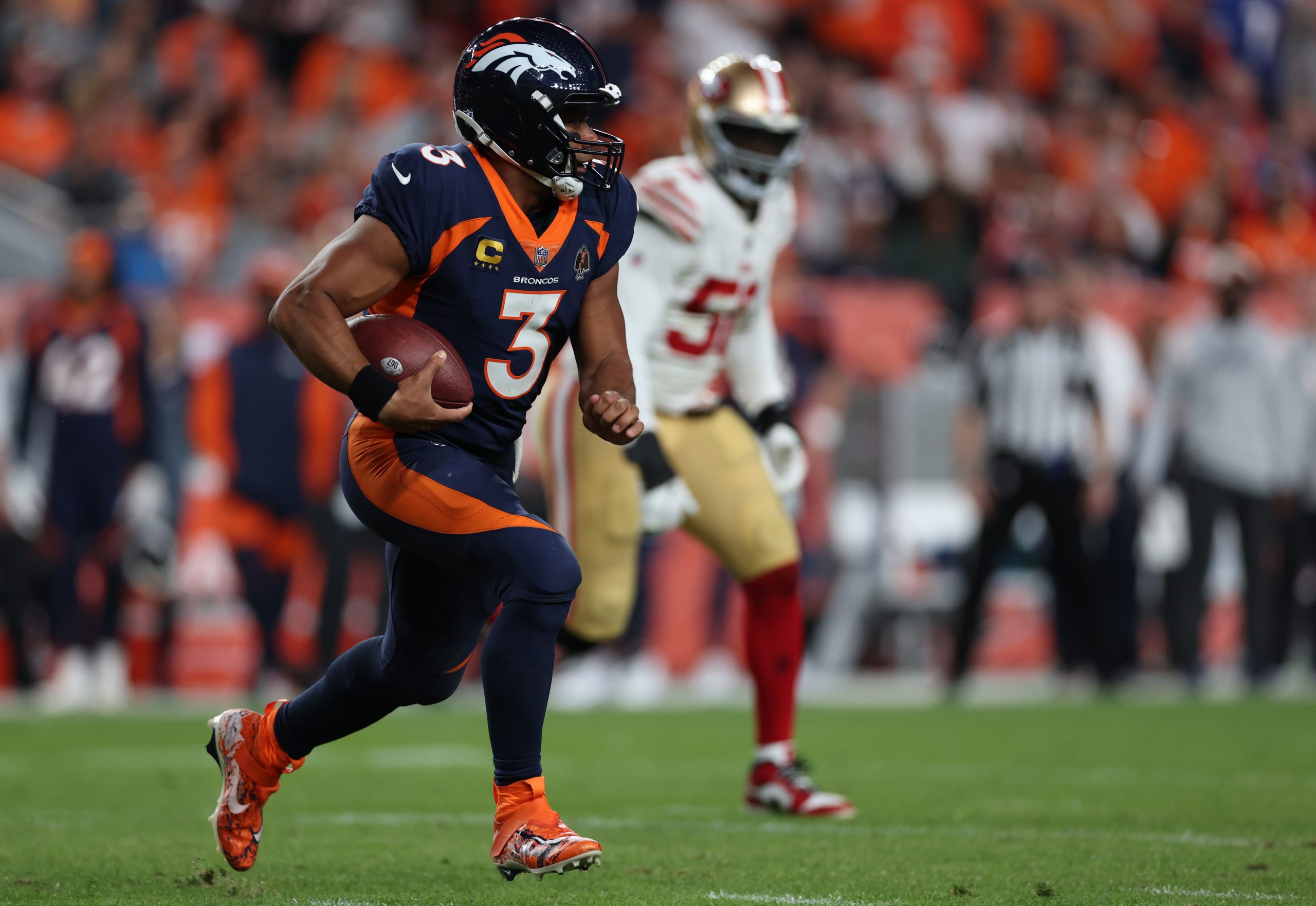 Russell Wilson #3 of the Denver Broncos rushes during the second half against the San Francisco 49e...