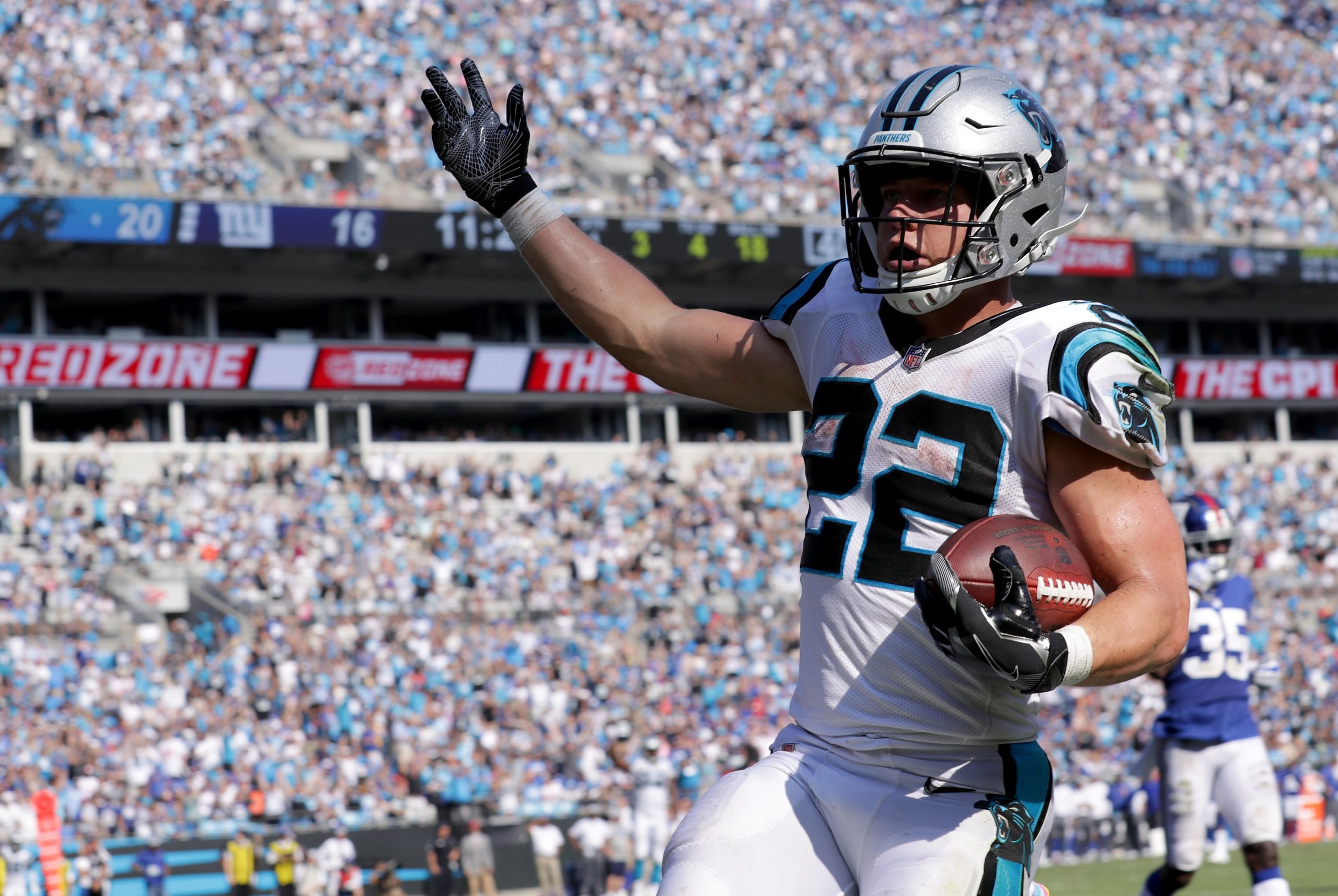 Christian McCaffrey #22 of the Carolina Panthers scores a touchdown against the New York Giants in ...