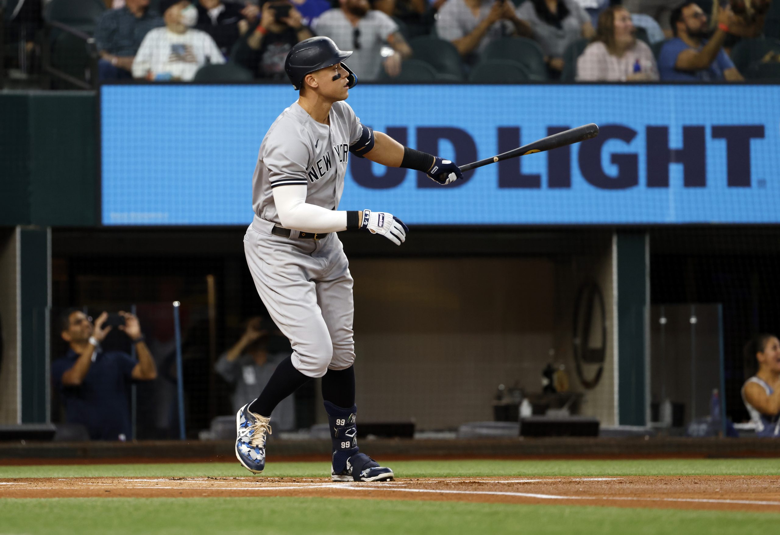 Aaron Judge #99 of the New York Yankees watches his 62nd home run of the season against the Texas R...