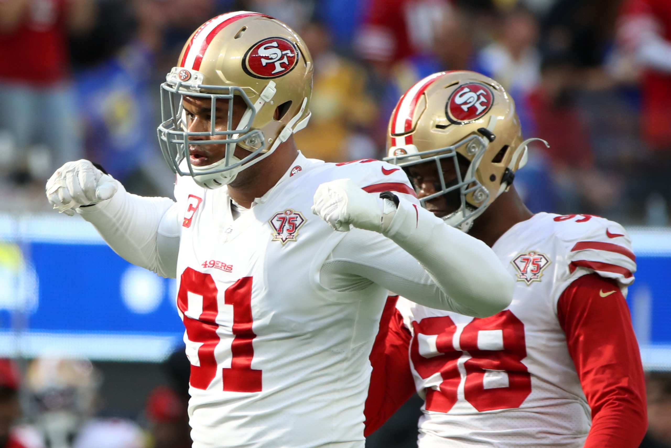 Arik Armstead #91 of the San Francisco 49ers reacts after sacking Matthew Stafford #9 of the Los An...