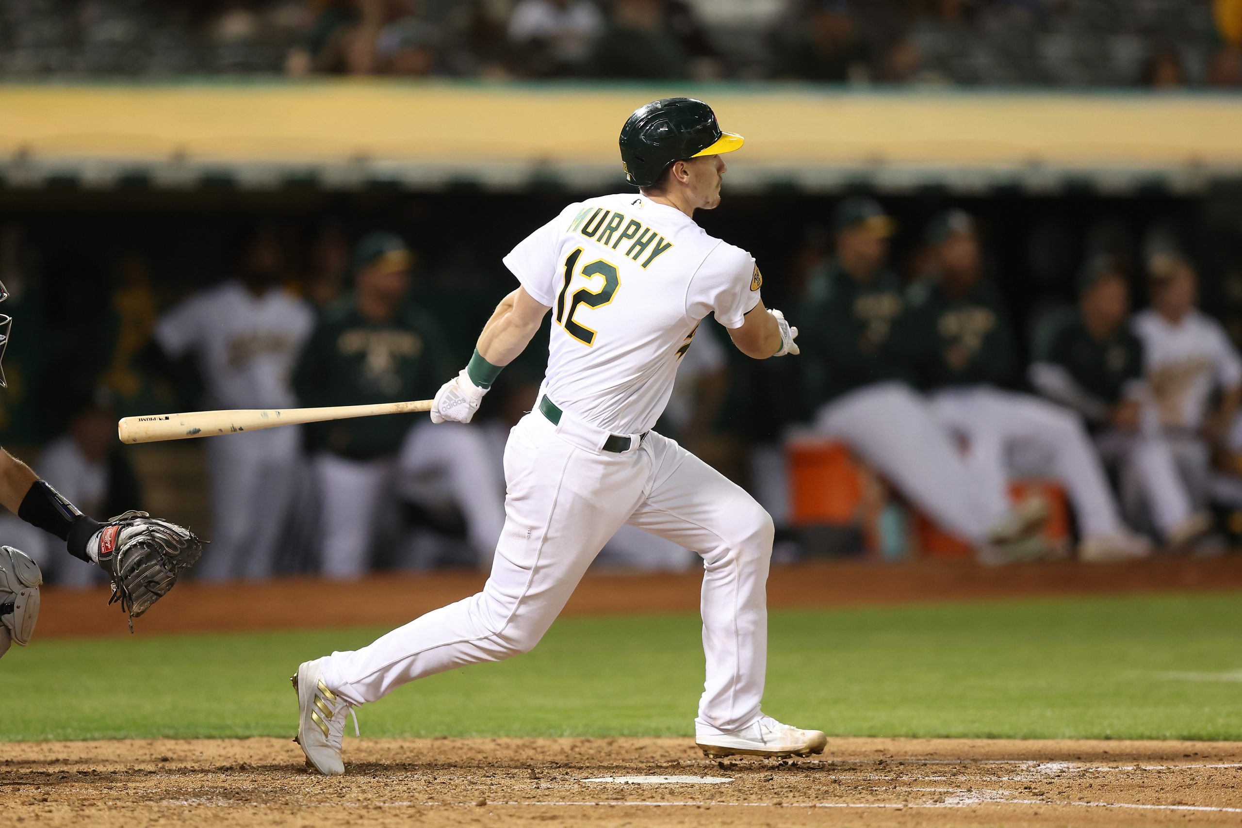 Sean Murphy #12 of the Oakland A's hits an RBI double in the bottom of the fifth inning at RingCent...