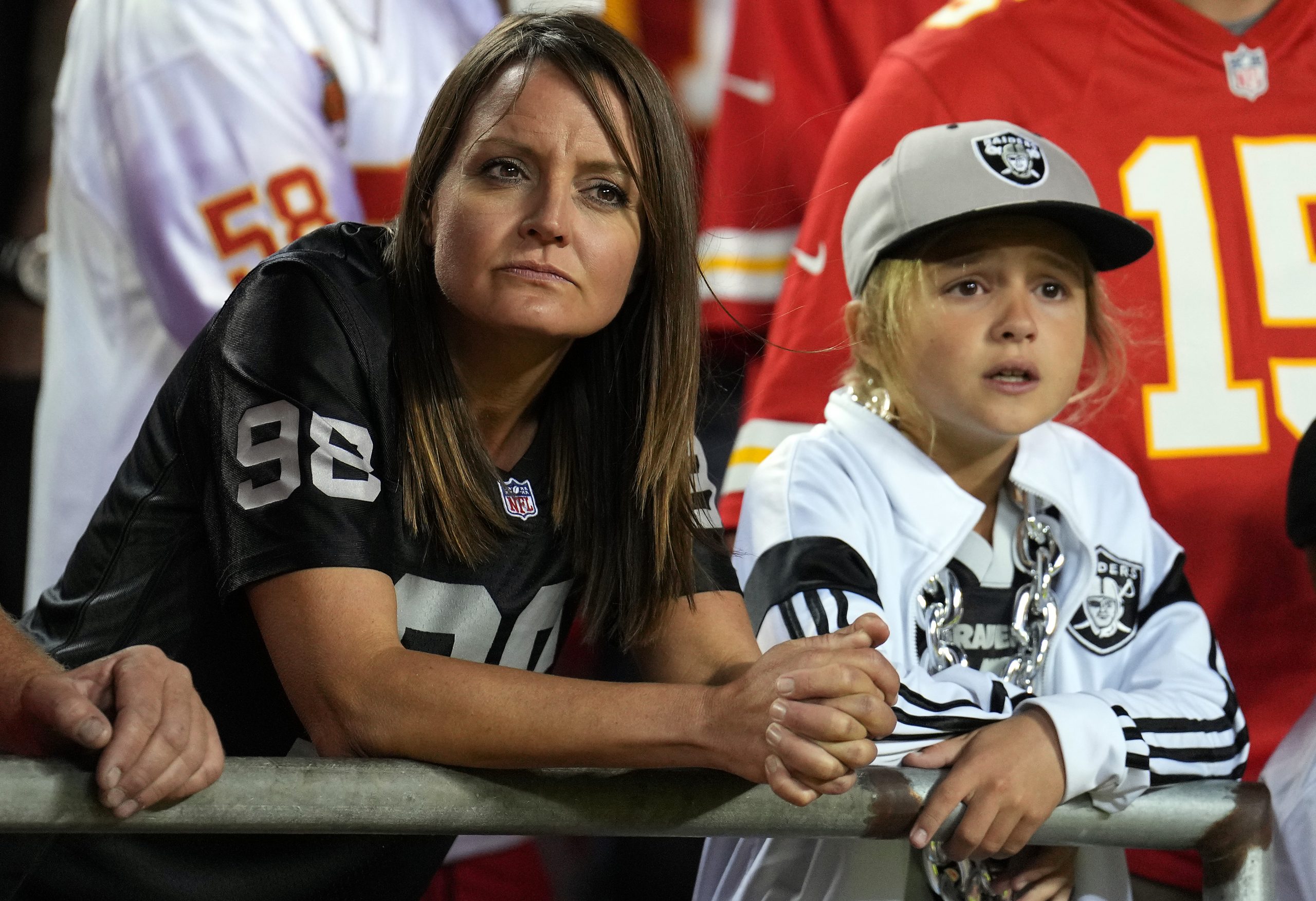 NFL fans watch as the Kansas City Chiefs defeat the Raiders 30-29 to win the game at Arrowhead Stad...