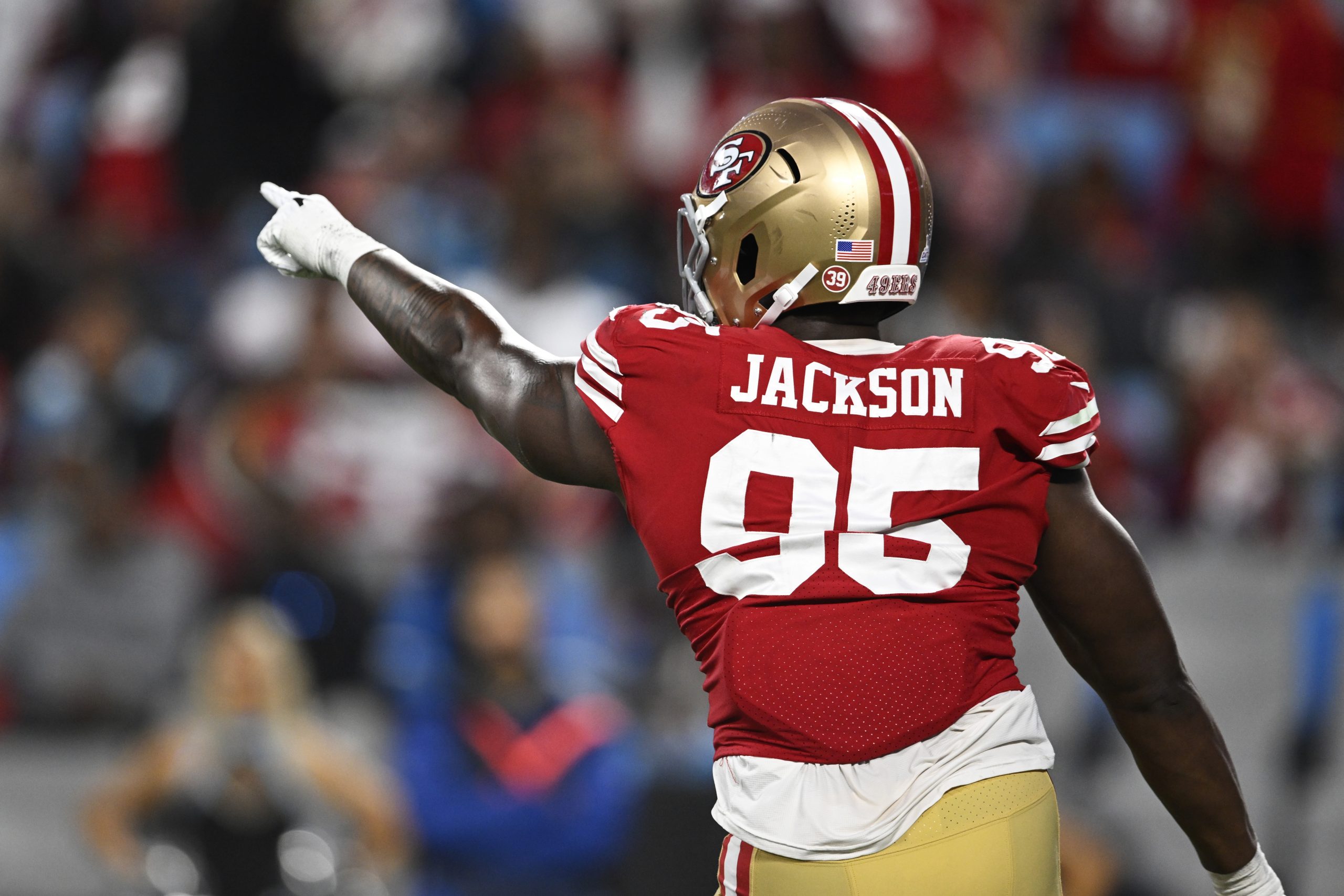 Drake Jackson #95 of the San Francisco 49ers celebrates a play in the fourth quarter against the Ca...