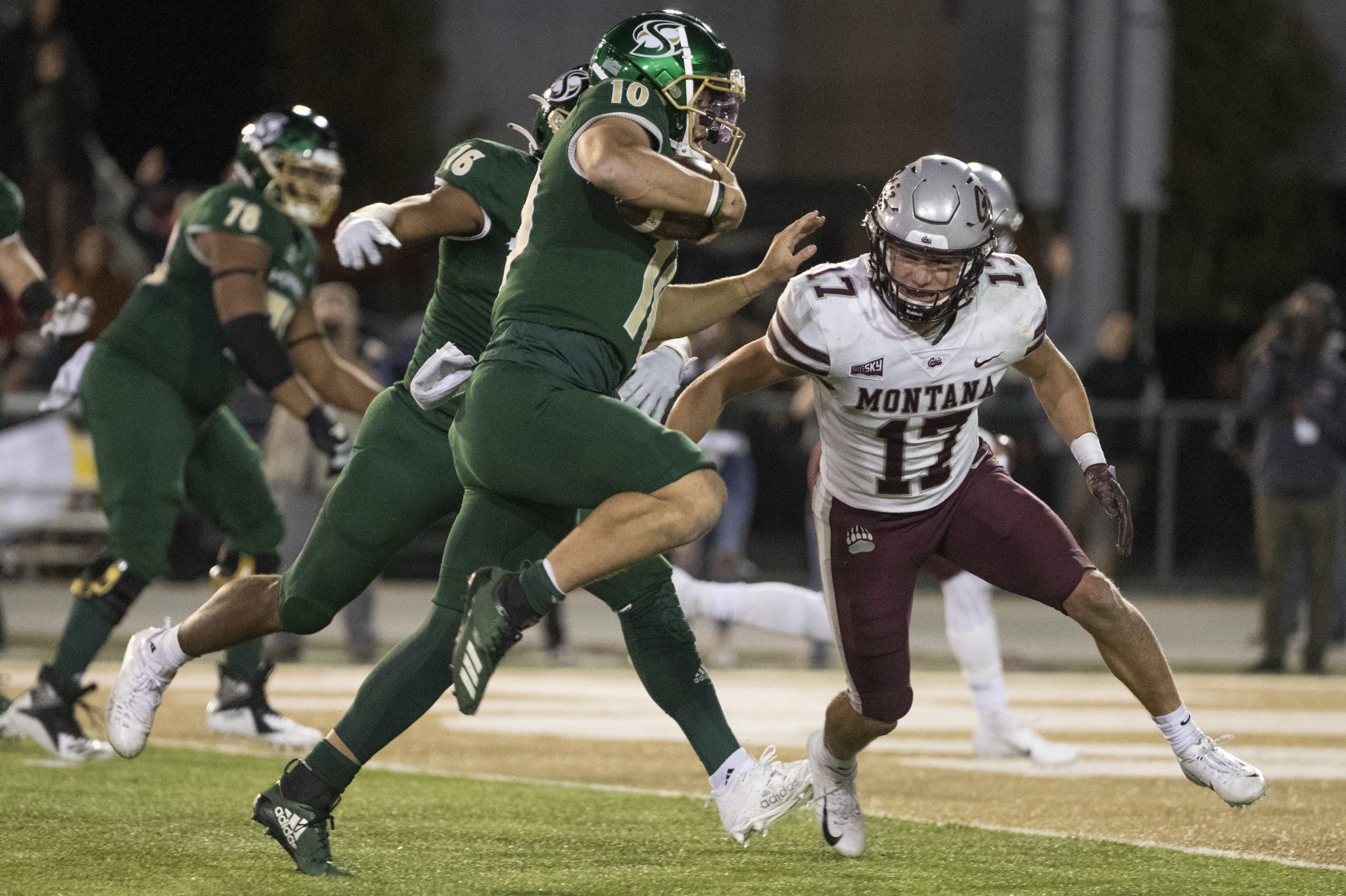 Robby Hauck #17 of the Montana Grizzlies runs down Asher O'Hara #10 of the Sacramento State Hornets...