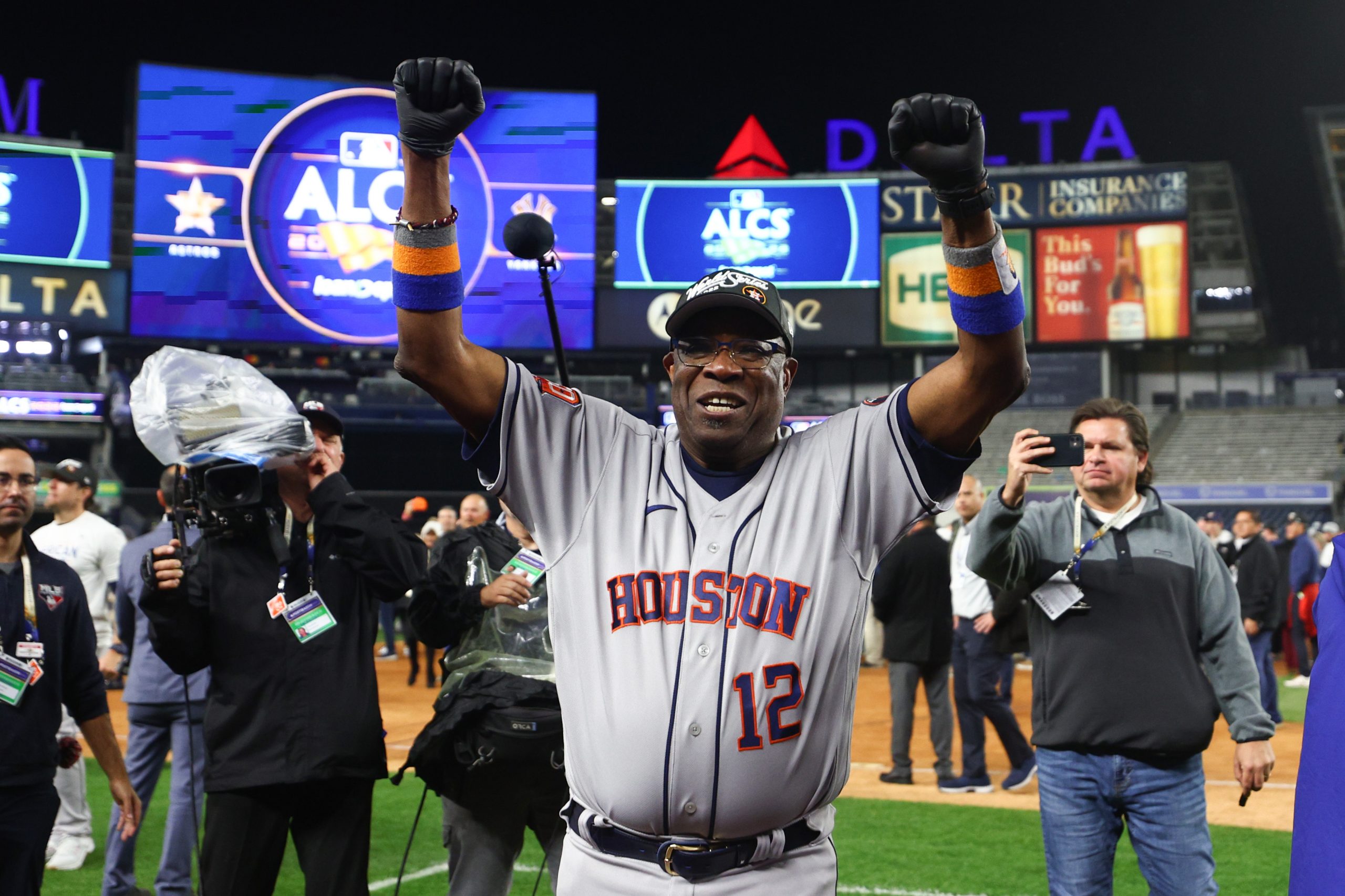 Manager Dusty Baker Jr. #12 of the Houston Astros celebrates after winning game four of the America...