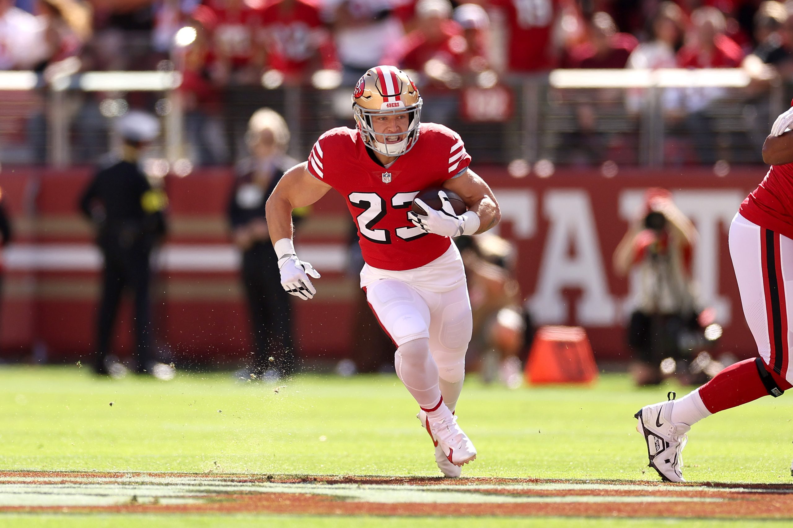 Christian McCaffrey #23 of the San Francisco 49ers runs with the ball in the first quarter against ...